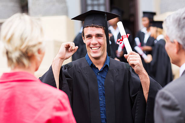 istock excited male graduate holding his diploma 475915165
