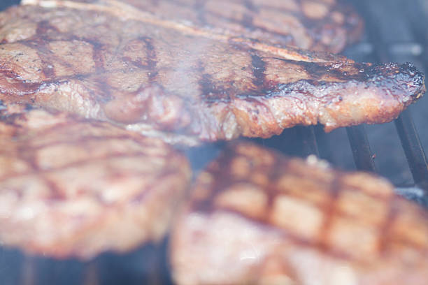 istock Fresh Steaks Grilling on the Barbecue 475916602