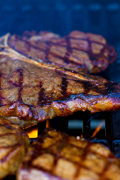 istock Fresh Steaks Grilling on the Barbecue 475916612