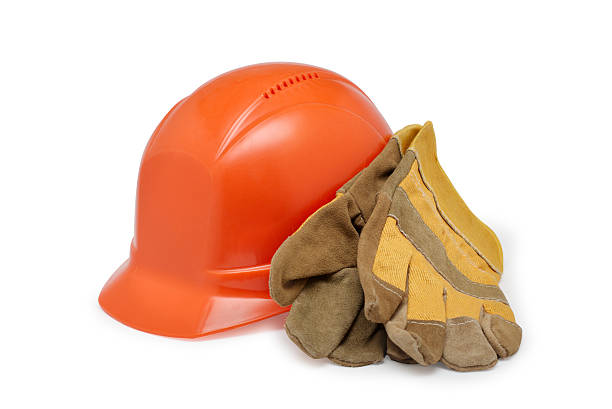 istock Orange helmet work and protective gloves on a white background 475916664