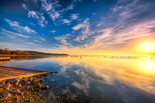 Colorful sunrise over a misty Benbrook Lake in North Texas
