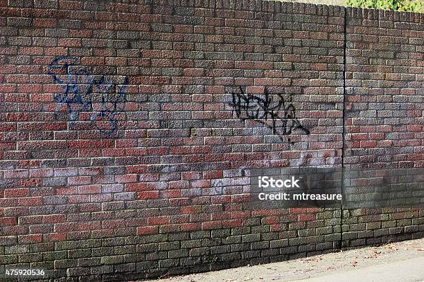 Image Of Old Wall Made From Textured Redbricks Graffiti Tags Stock Photo - Download Image Now