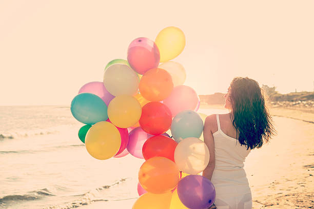 istock rear view of woman having fun holidays warm filter applied 475923480