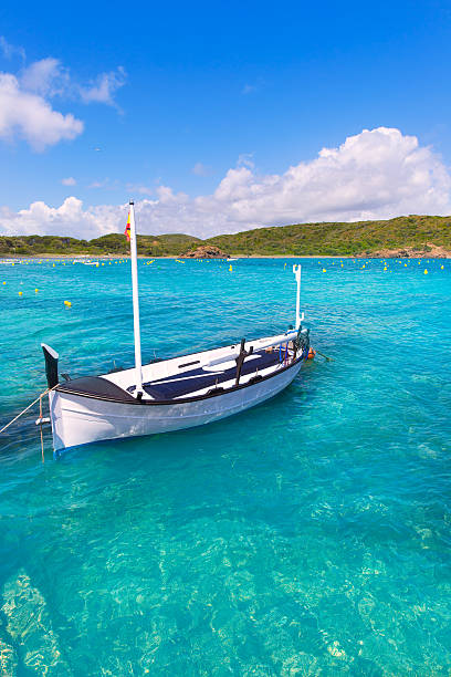 Menorca Es Grau clean port with llaut boats in Balearics Menorca Es Grau clean port with llaut boats in Balearic Islands balearics stock pictures, royalty-free photos & images