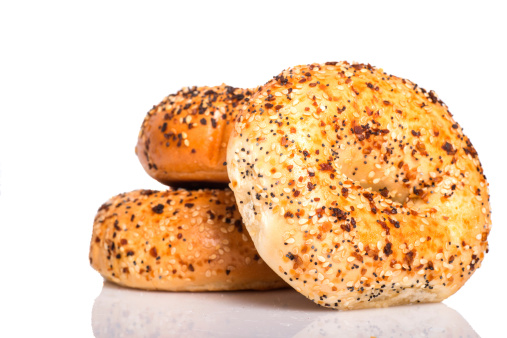 Delicious freshly baked Everything Bagel on a white background