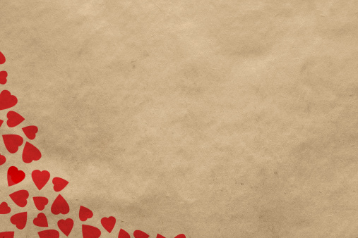 Valentine's day vintage background with hearts on old paper texture