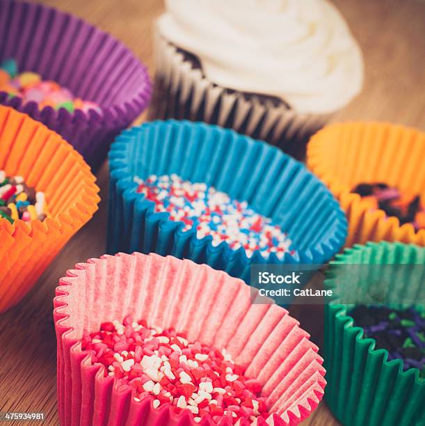 Cake Baking Supplies Cupcake Liners Sprinkles And Cupcake Stock Photo - Download Image Now