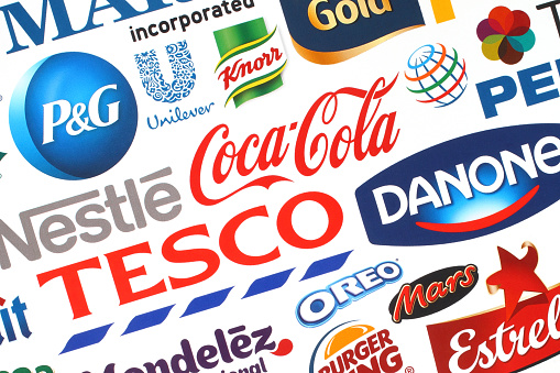 Kiev, Ukraine - May 07, 2015:Collection of popular food logos companies printed on paper:Coca-Cola, Mars, Kraft, Pepsi, McDonald's, Nestle, Tesco and others