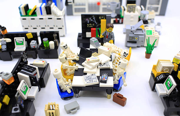Hong Kong, Сhina - March 26, 2015:  Studio shot of Lego people in office, combine from different set. Legos are a popular line of plastic construction toys manufactured by The Lego Group in Denmark