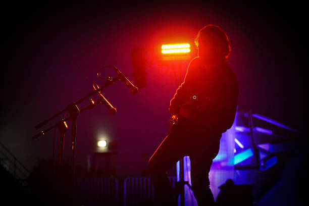 istock Guitar Solo in Red Silhouette 475941360