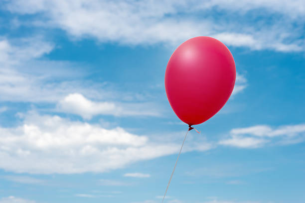 istock red balloon in the sky 475945644