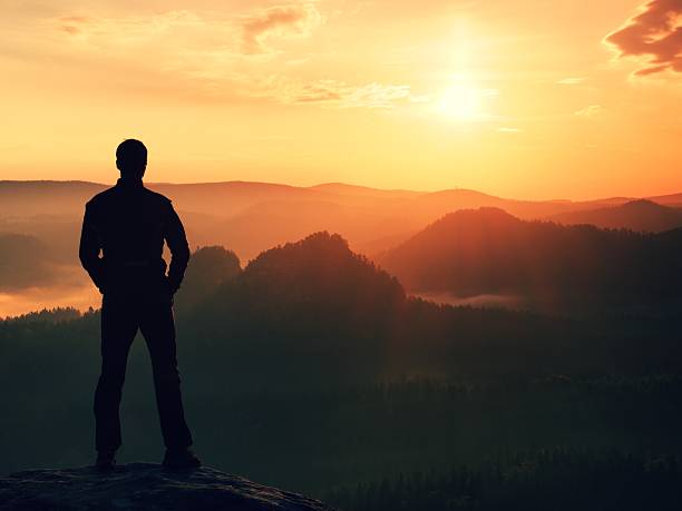 istock Hiker in black  stand on peak in rock empires park 475945868