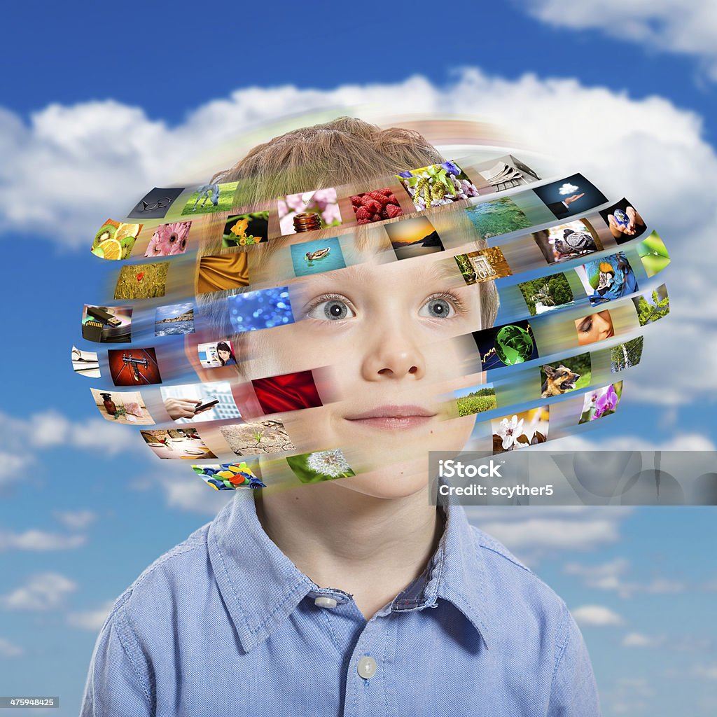 Young boy. Technology concept. A young boy has different media images around his head. Child Stock Photo