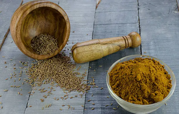 cumin powdered from seeds using mortar and pestle