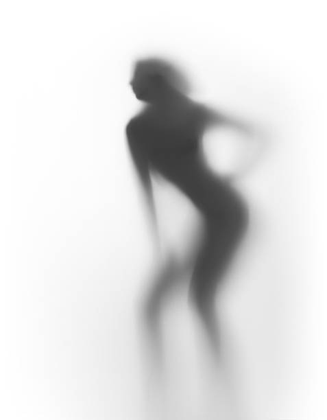 istock Beautiful slim woman silhouette behind a curtain 475952944