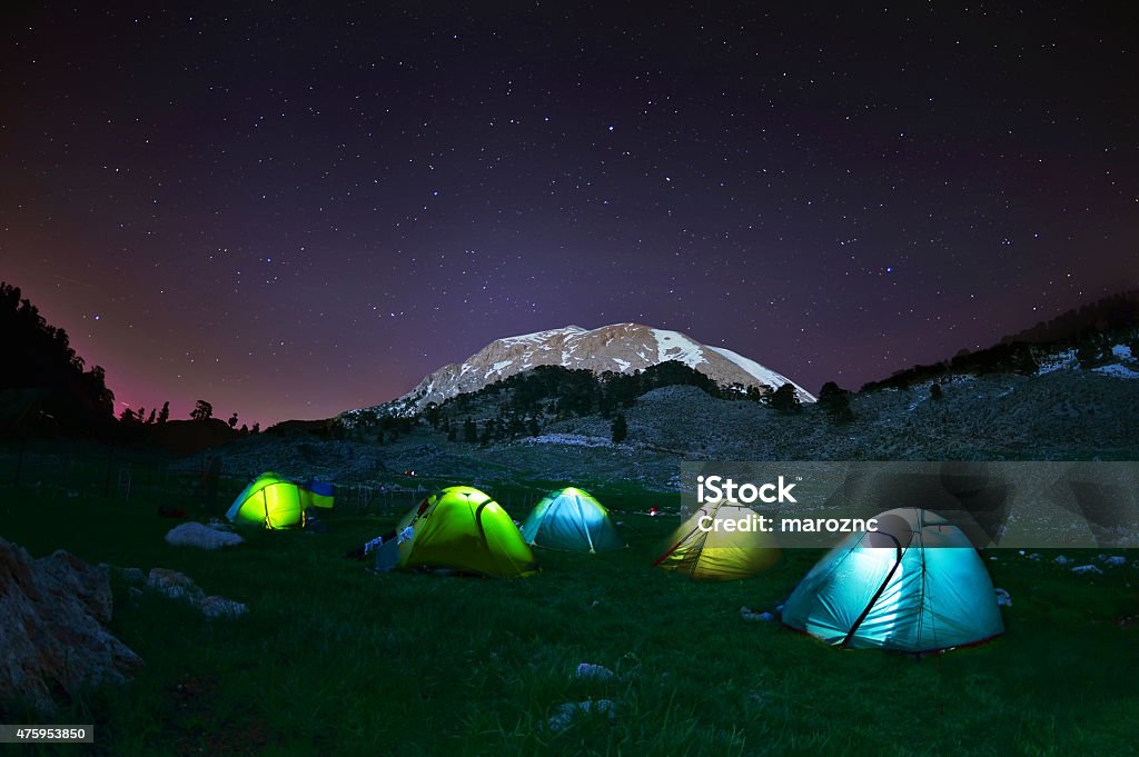 Illuminated yellow camping tent under stars at night Illuminated yellow camping tent under stars at night,Turkey Camping Stock Photo
