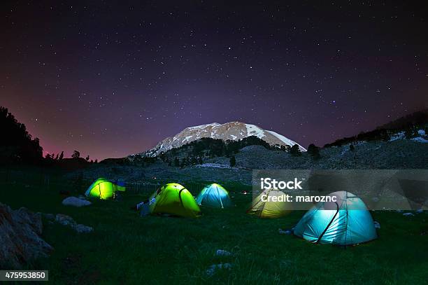 Illuminated Yellow Camping Tent Under Stars At Night Stock Photo - Download Image Now