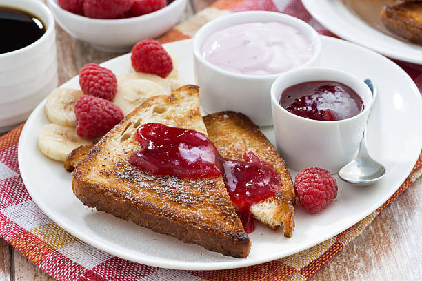 istock sweet toasts with fresh raspberry, jam and yoghurt for breakfast 475959352
