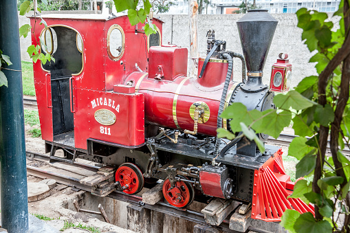 Lima, Peru - January 21, 2015: Vintage red Peruvian steam train in Lima park Parque de la Amistad