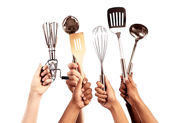 istock Totally equipped for Masterchef: six hands holding up kitchen utensils 475961973