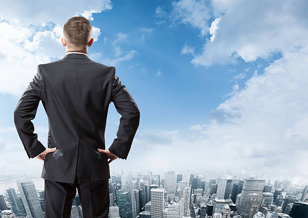 istock businessman looking at the city 475962492