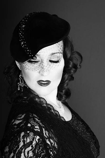 istock Arrogant 1940s style movie queen looking down. 475963317