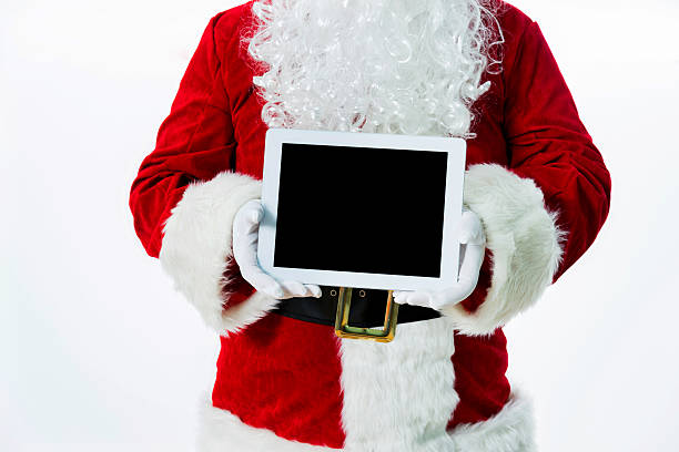 istock Santa claus showing digital tablet 475963638