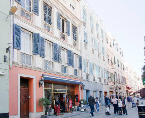 Gibraltar, Gibraltar - mars 27, 2015: Street view of Main street, Gibraltar town . Shops, tourists and locals walking along it. This pedestrianised street is the main place for shopping, commerce and entertainment.  