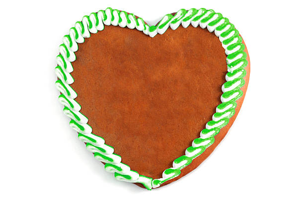 istock green Gingerbread heart with copyspace on isolated white background 475967412