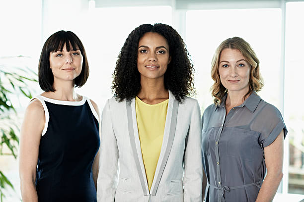 portrait of confident businesswomen - three people group of people standing business person fotografías e imágenes de stock