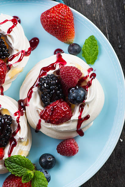 istock Homemade pavlova meringue with summer fresh berries 475970304