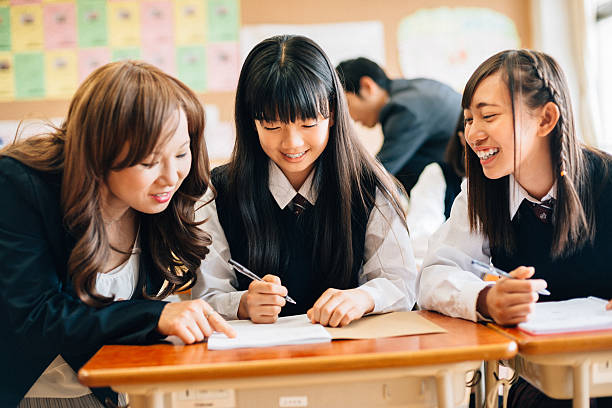 istock Teacher Assisting Students in Japanese Junior High School 475971002