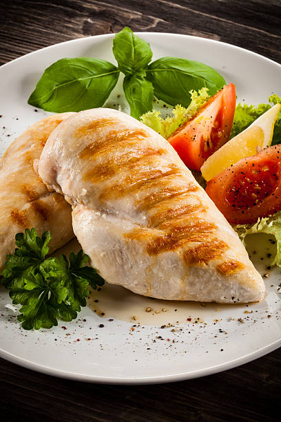 istock Roast chicken fillets and vegetables 475971438