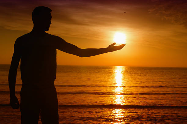Man shadow enjoying the sunrise