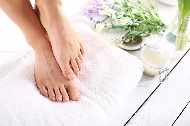 Women's feet Beautiful feet of a woman during treatments. human foot stock pictures, royalty-free photos & images