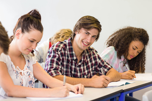 Written Notes Student Students Writing Notes In Classroom Stock Photo - Download Image Now ...