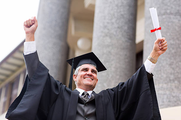 istock excited middle aged university graduate 475977283