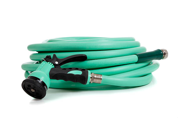 istock Green garden hose with spray nozzle 475980843