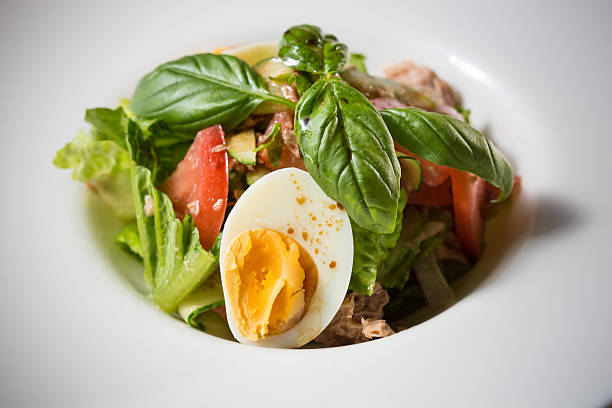 istock plate of spring mix salad with strawberry, eggs and tuna 475981130
