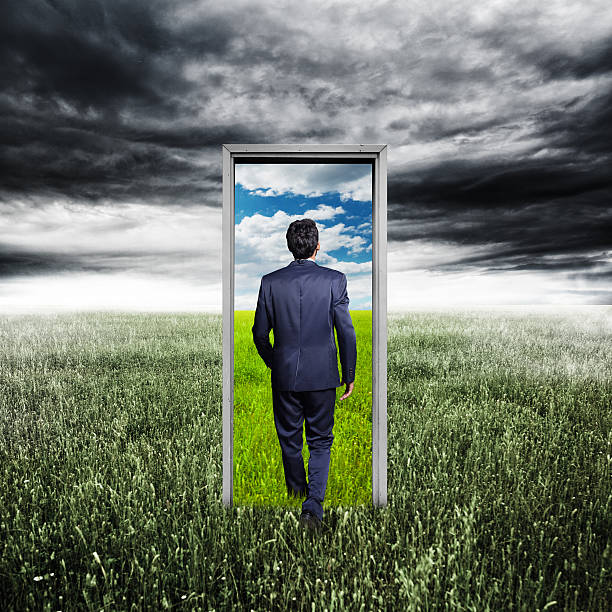 istock Businessman walking to opened door 475981348