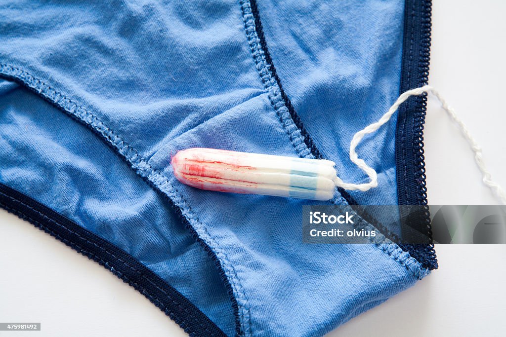 Woman hygiene protection Woman hygiene protection, close-up.menstruation calendar with cotton tampons 2015 Stock Photo