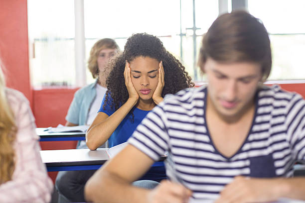 istock Thoughtful female student in classroom 475981858