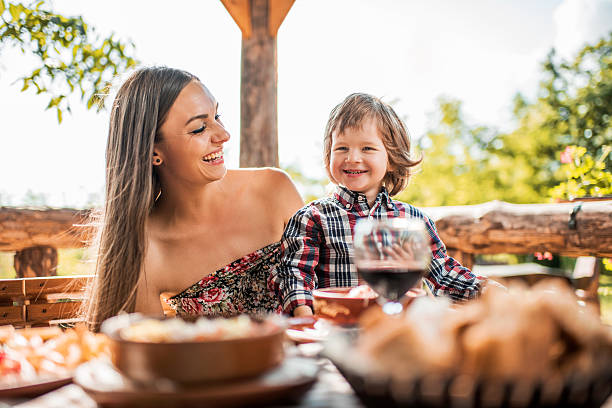 istock Cheerful mother and son enjoying in a restaurant. 475981966