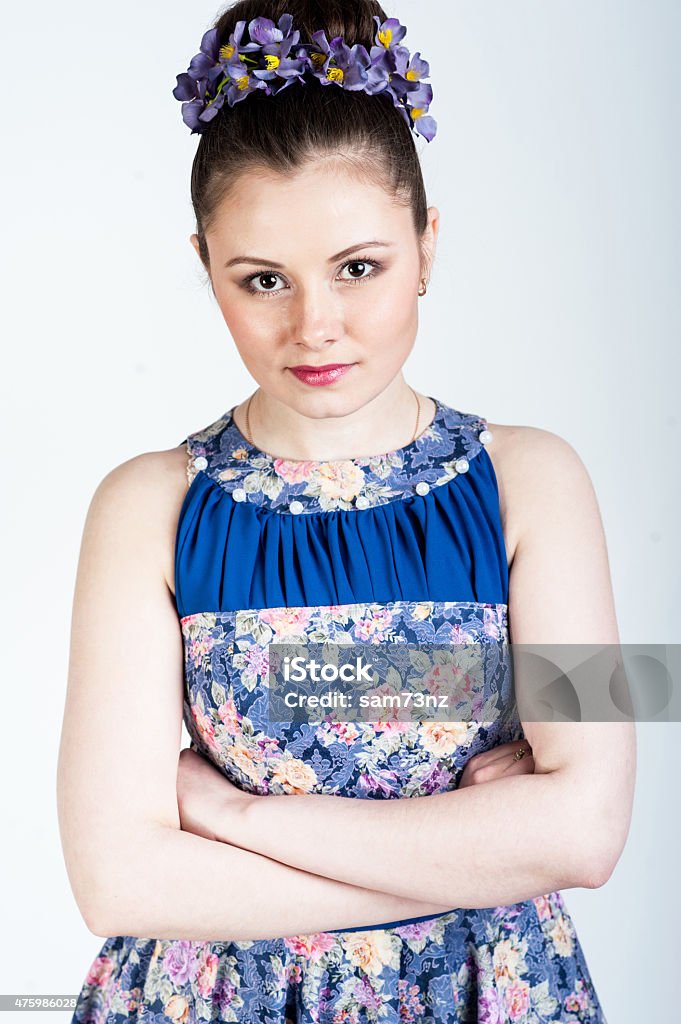 Nice girl with crosseg arms on white background 2015 Stock Photo