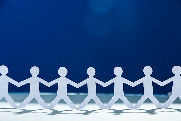istock Group of people holding hands 475987786