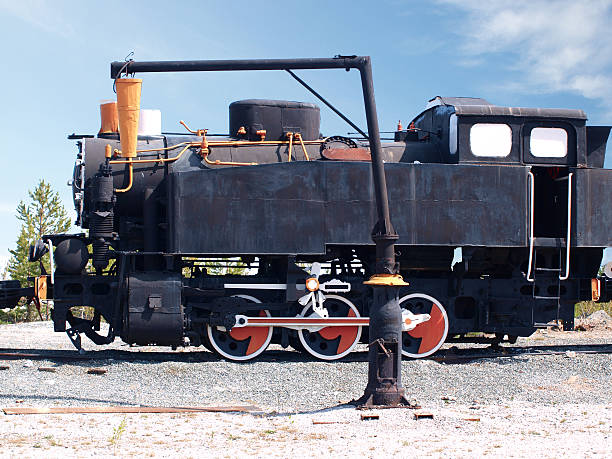 istock Old soviet locomotive on a background of blue sky 475988314