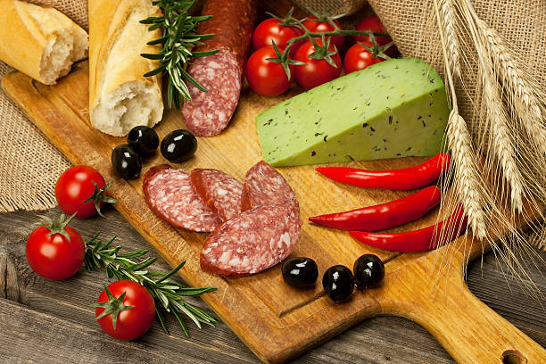istock Cheese, salami and bread  on a board 475988375