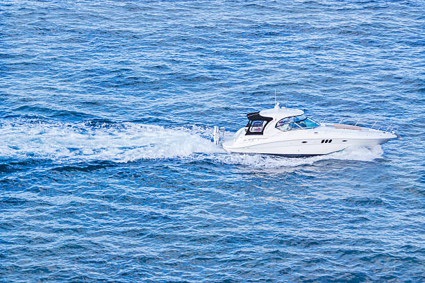 istock White speedboat on the Pacific ocean, copy space 475990972