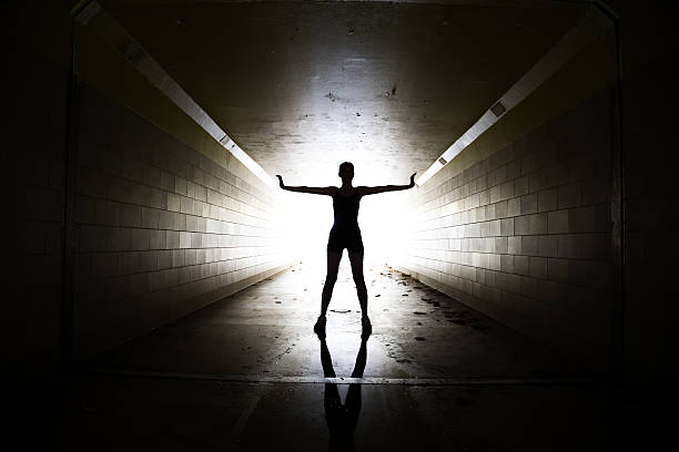 istock Female athlete posing in a tunnel 475991024