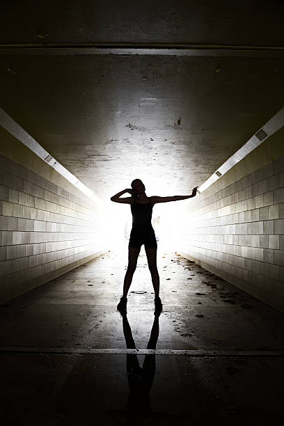 istock Female athlete posing in a tunnel 475991028